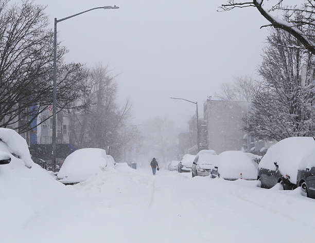 istock Man walk along snow covered street 507293472
