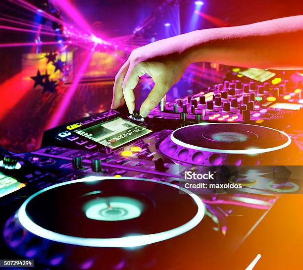 Dj Playing The Track Stock Photo - Download Image Now - DJ, Turntable, Arts Culture and Entertainment