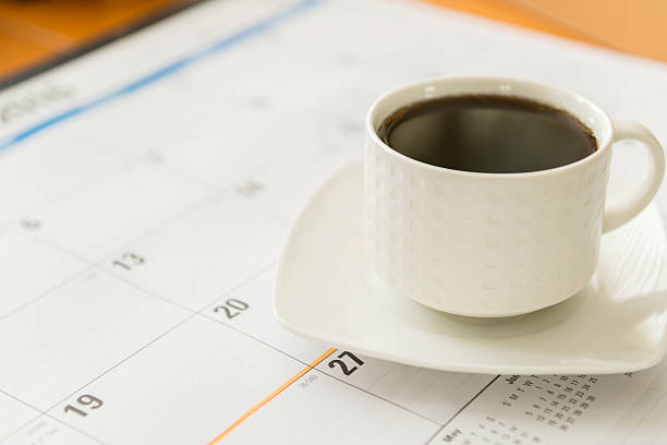 istock cup of coffee with calendar 507294548
