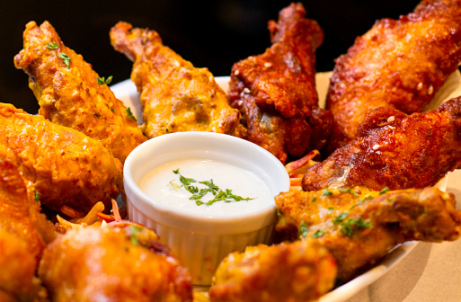 A variety of flavors of jumbo chicken Wings and ranch