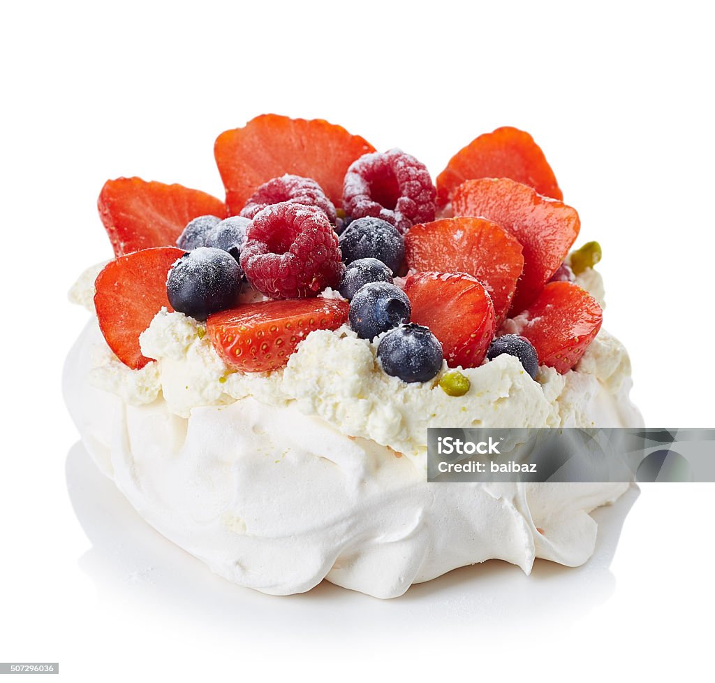 Pavlova meringue cake Pavlova meringue cake with cream and berries isolated on white background Pavlova - Dessert Stock Photo