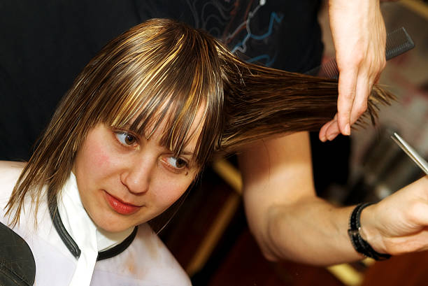Young woman at the hair studio