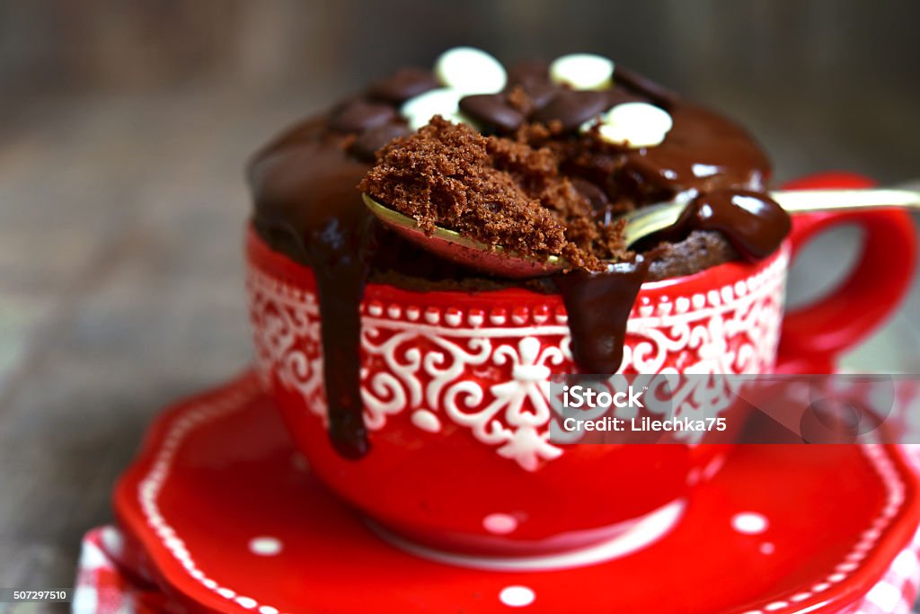 Chocolate mug cake. Chocolate mug cake decorated with chocolate glaze. Cake Stock Photo