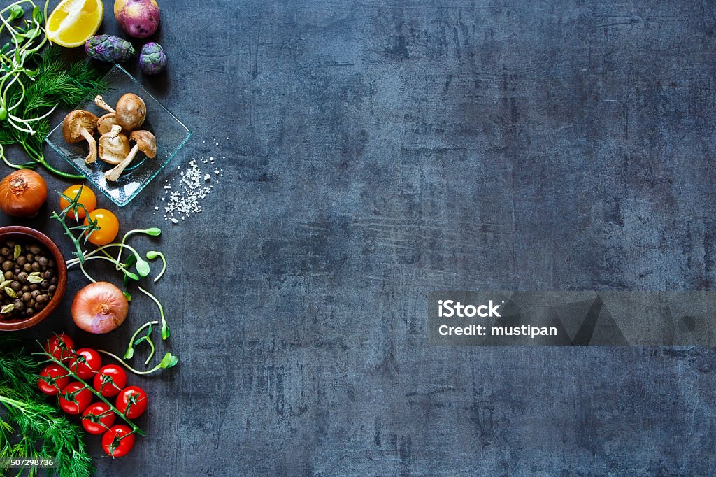 Tasty vegetables background Raw organic vegetables with fresh ingredients for healthily cooking on vintage background, top view, banner. Vegan or diet food concept. Background layout with free text space. Food Stock Photo