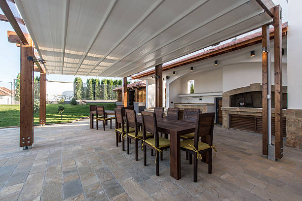 istock Long table and chairs on veranda in luxury villa exterior 507298862