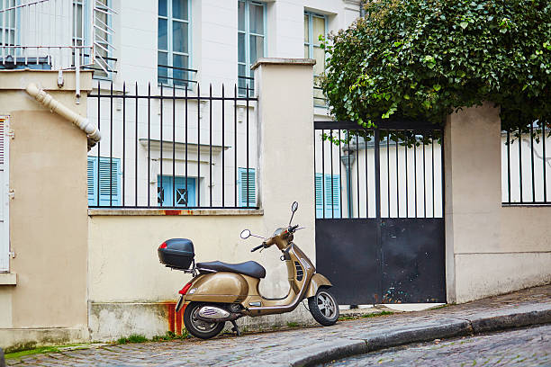 istock retro scooter parked on a Parisian street 507300206