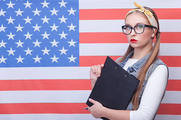istock Attractive young girl is working in USA 507300830
