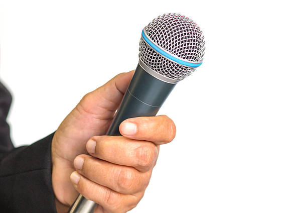 istock microphone, which woman reporter is holding and waiting for the 507303220