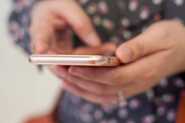 istock Close up of woman using mobile smart phone 507304476