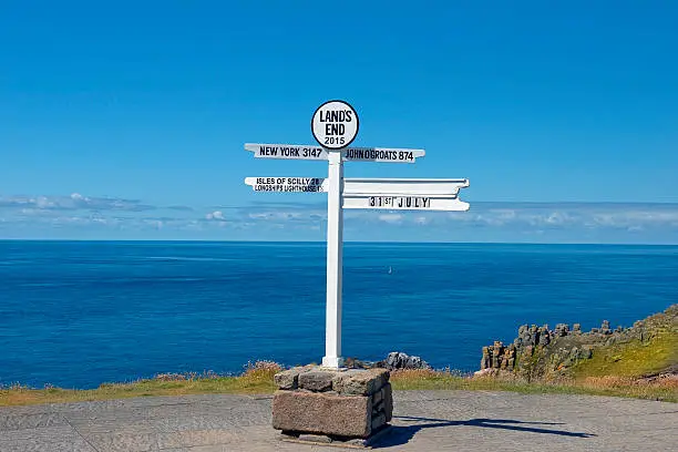 distance signpost at Land's End, Penwith Peninsula, Cornwall, England, most westerly point of England on the Penwith peninsula eight miles from Penzance on the Cornish coast