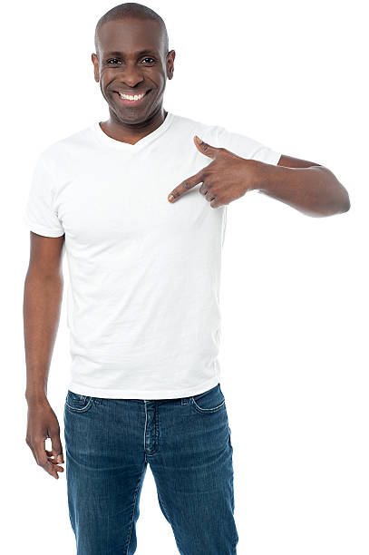 istock Smiling man pointing at blank white t-shirt 507309879