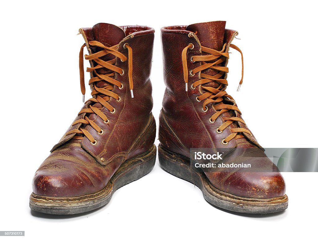 The Combat Boots. Old army paratroopers combat boots on white background. World War II Stock Photo