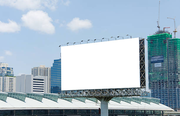 istock large blank billboard on road with city view background 507315017