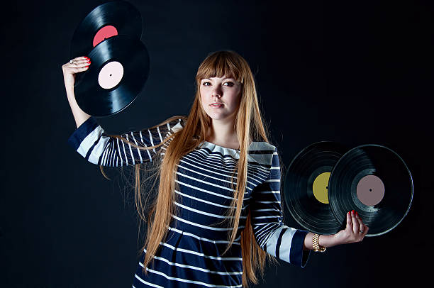 Girl with vinyl discs stock photo