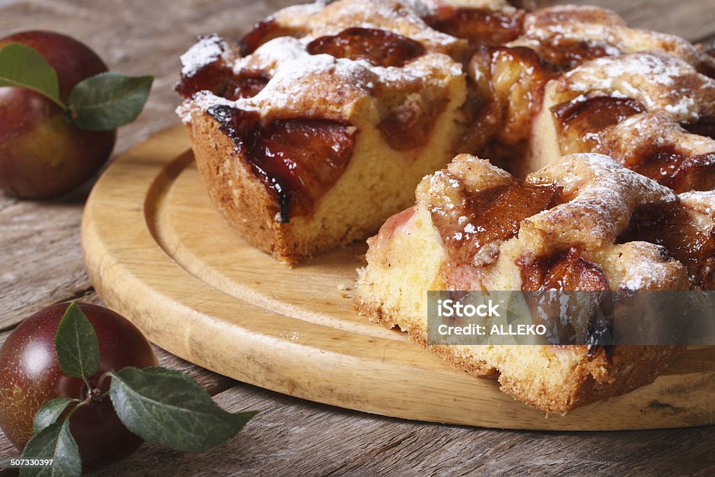 sliced plum cake close up on chopping board horizontal delicious sliced plum cake close up on chopping board horizontal Backgrounds Stock Photo