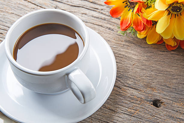 istock Cup of coffee on wooden table 507335161