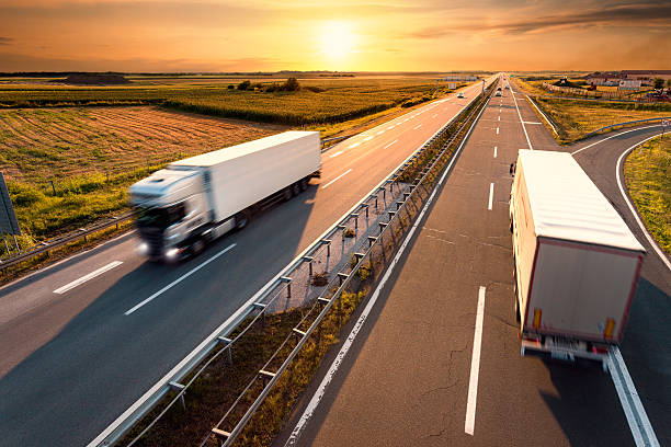 istock Two trucks on highway in motion blur 507335261