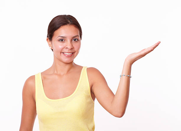 istock Friendly latin female holding her left palm up 507335589