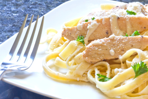 Chicken Fettuccini alfredo with fresh curly parsley