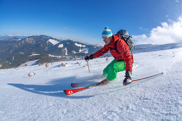 istock Skier skiing downhill in high mountains against sunset 507335979