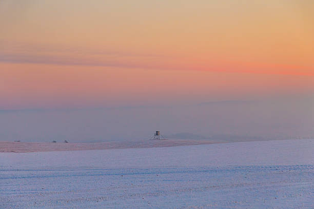 istock winter landscape with high seat and sunset 507363540