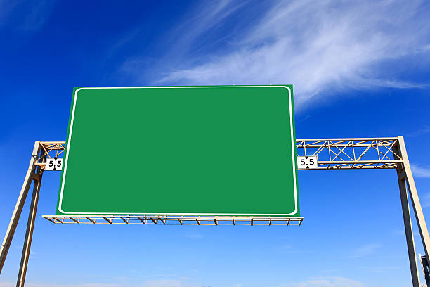 istock Green highway sign with blue sky 507366026