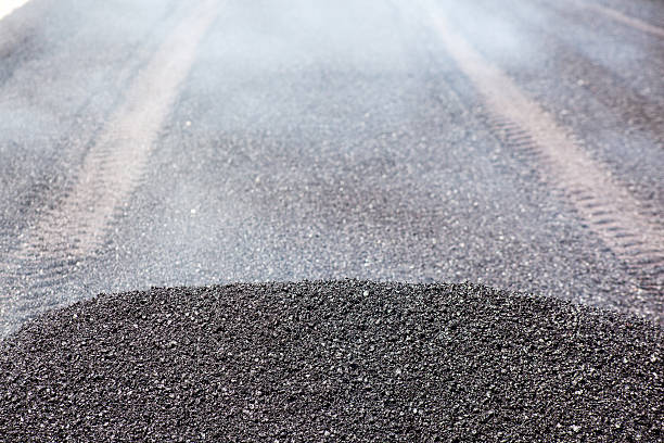 istock Unrolled hot black fine asphalt 507369016