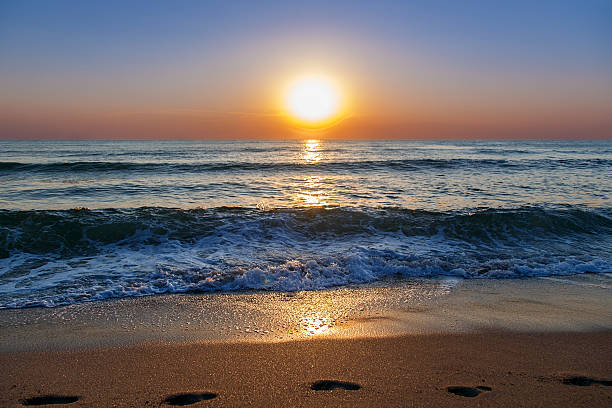 istock beach sand sea sky sun sunset 507369956