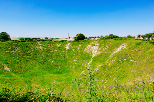 La Boisselle, France - July 24, 2012:   The Lochnagar bomb crater outside the village of La Boisselle in the Somme region of France. Over 90m in diameter and 20m deep, it was created by the blast from two underground bombs detonated on July 1st 1916 during World War 1.