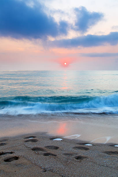istock beach sand sea sky sun sunset 507370322
