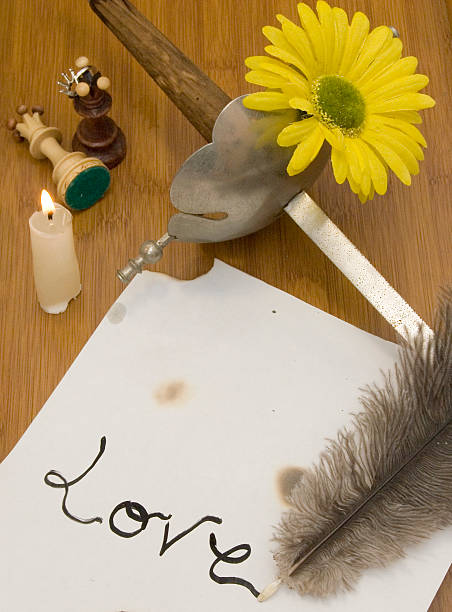 istock Ancient sword and former pen writing on a wooden table 507370821