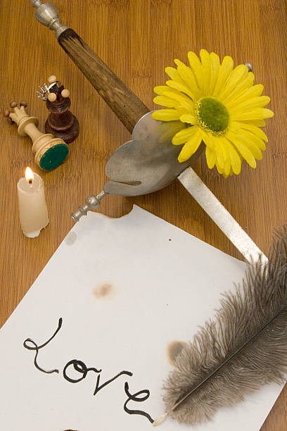 istock Ancient sword and former pen writing on a wooden table 507370823