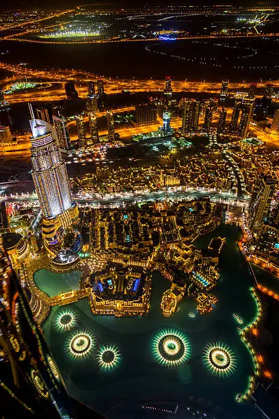 Glowing illuminated Downtown Dubai at Night to the horizon. Ultra Wide Angle, Aerial View. Dubai, United Arab Emirates.
