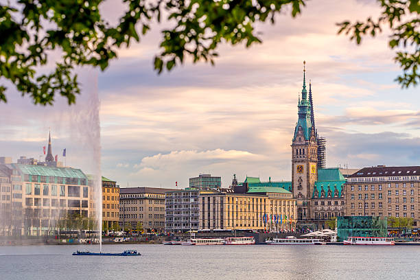 Hamburg Town hall, Alster Lake The Lake Binnenalster in Hamburg in Germany during spring time. In the toreground the famous Alter Lake fountain. hamburg stock pictures, royalty-free photos & images