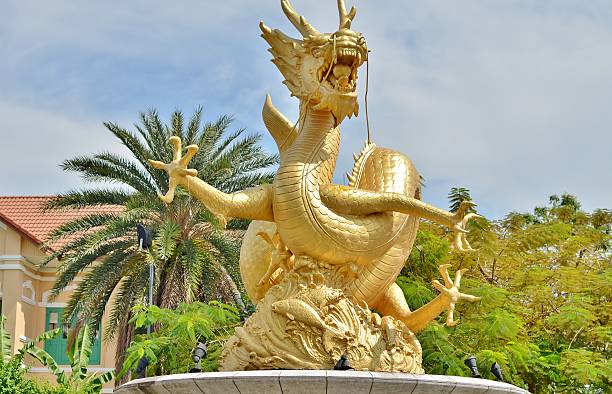 istock Statue of golden dragon in the Queen Sirikit Public Park 507373394