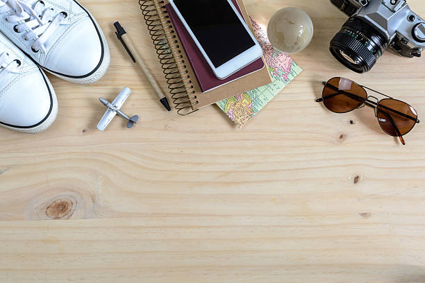 istock Outfit of traveler on wooden background and copy space, 507373916