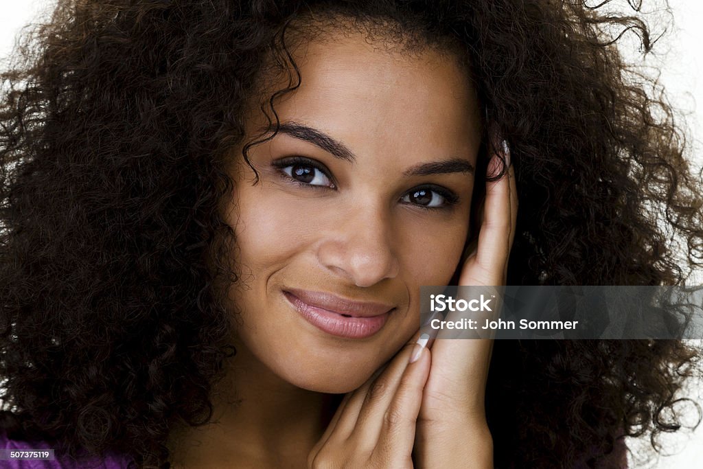 Beautiful mixed race woman Closeup of a beautiful mixed race woman with curly hair  20-24 Years Stock Photo