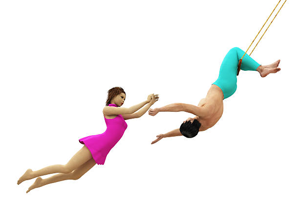 Trapeze artists in flight isolated stock photo