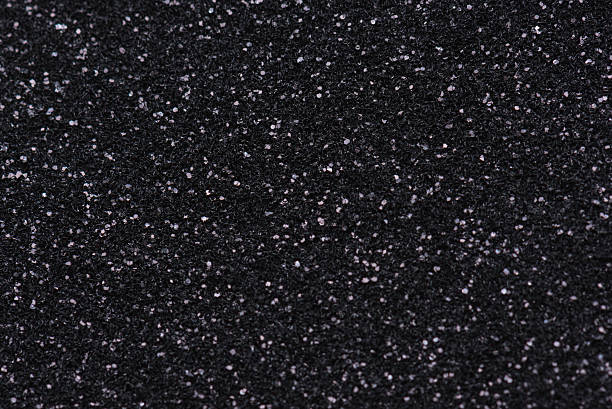 istock Black giltter bokeh abstract background 507375820