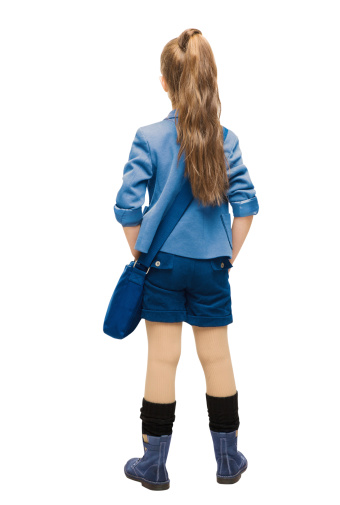 Schoolgirl in uniform back side view. School girl backside, looking rear, isolated over white background