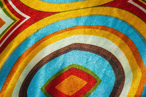 istock Silk fabric texture, abstract pattern, red yellow green brown wh 507377490