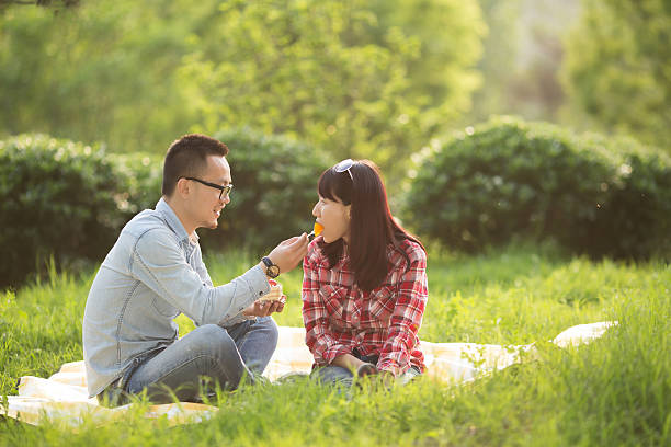 istock Happy young man with a woman having picnic 507377907