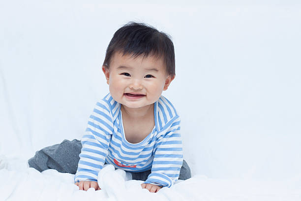 istock Cute Chinese baby boy in sailor suit 507378264