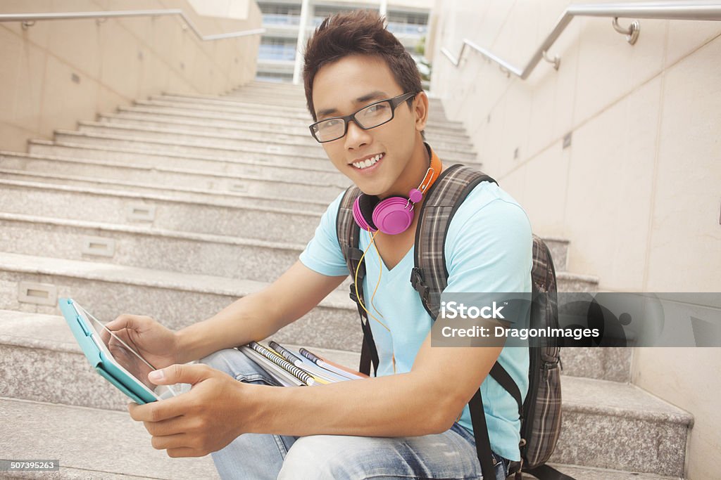 Student before lessons Portrait of a student boy with workbooks and touchpad Child Stock Photo