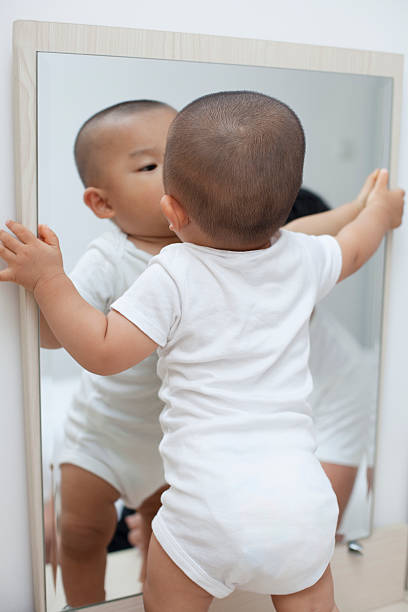 istock Chinese baby boy playing in front of a mirror 507396258