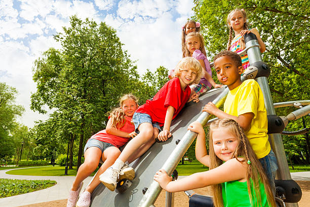 istock Group of kids on playground construction together 507396435