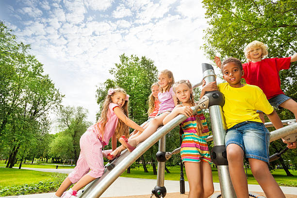 istock Kids on playground construction play, girl climb 507396443