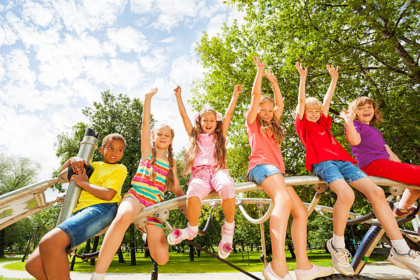 istock Children on round bar of playground construction 507396451