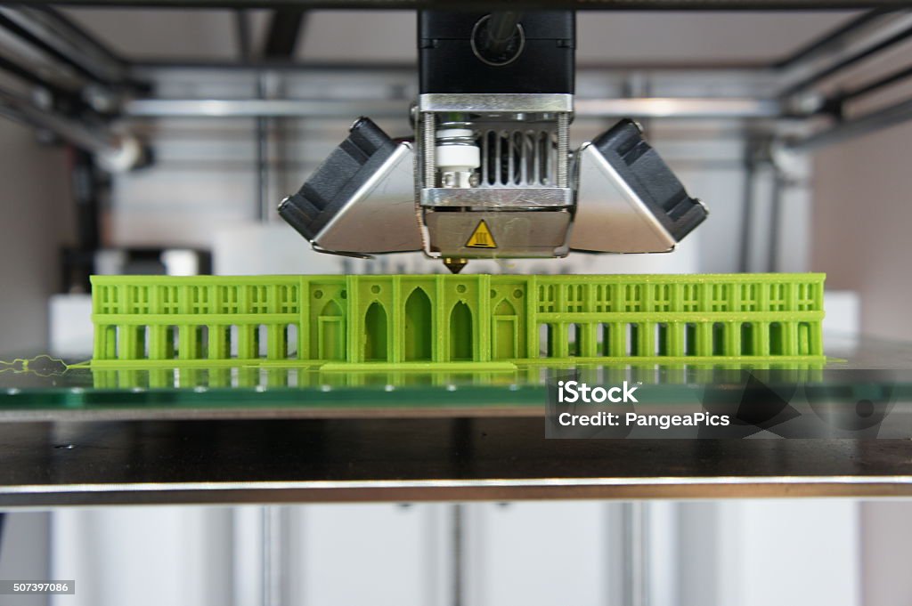 3D printed architectural model Bright green architectural model being 3D printed on glass printbed 3D Printing Stock Photo