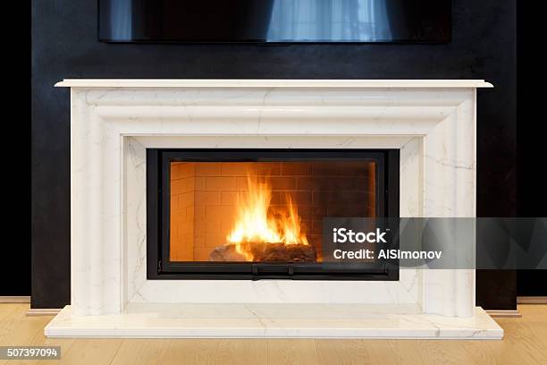 White Marble Fireplace And Burning Fire Stock Photo - Download Image Now - Mantelpiece, Fireplace, Fire - Natural Phenomenon